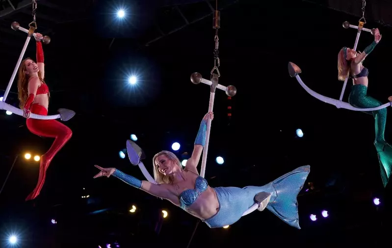 mermaids performing in the air at Pirates Voyage